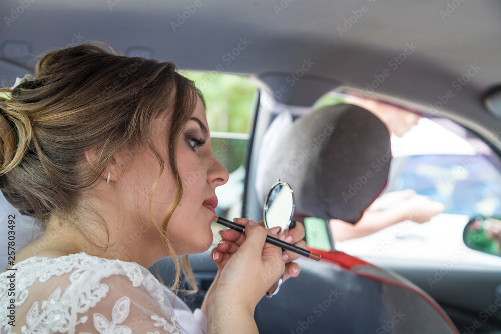 Russian bride near car in a city in a day Russian bride near car in a city in a day