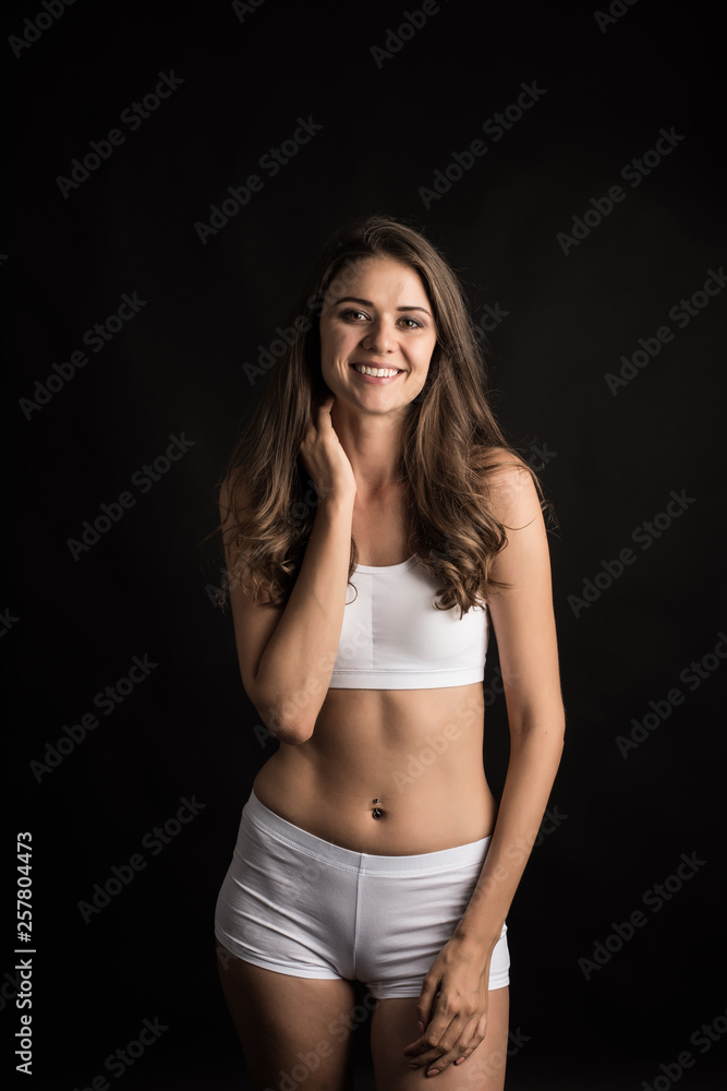 Beautiful woman with healthy body on black background Beautiful woman with healthy body on black background