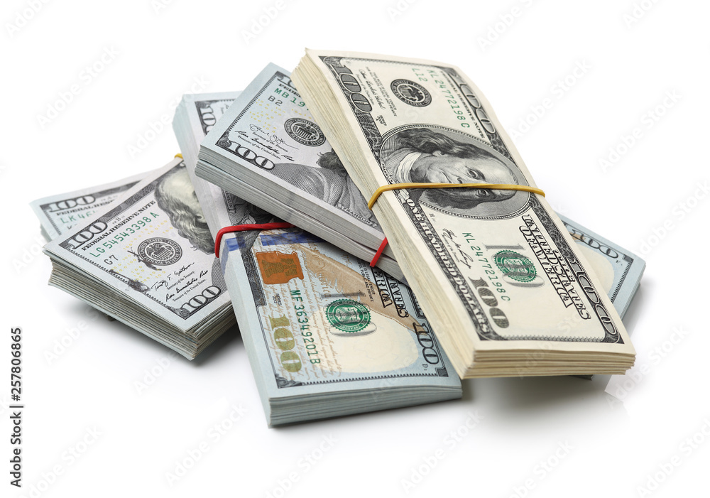 Many bundle of US 100 dollars bank notes isolated on white background Many bundle of US 100 dollars bank notes isolated on white background