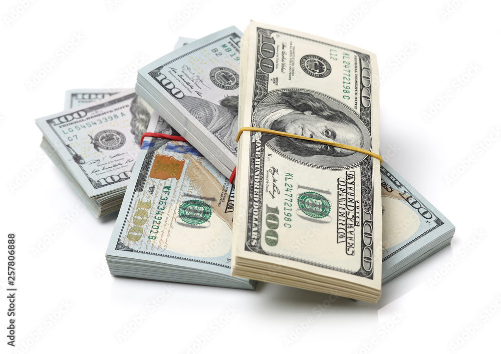 Many bundle of US 100 dollars bank notes isolated on white background Many bundle of US 100 dollars bank notes isolated on white background