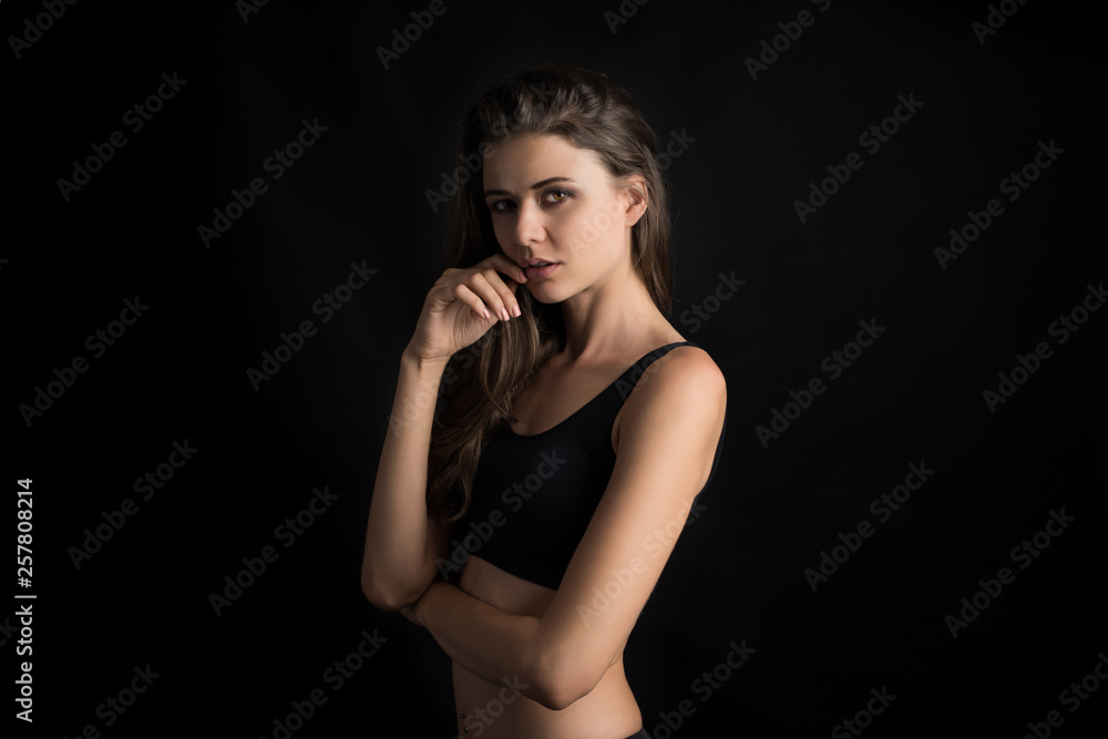 Beautiful woman with healthy body on black background Beautiful woman with healthy body on black background