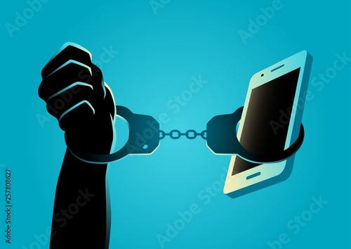 Hand handcuffed with a smartphone