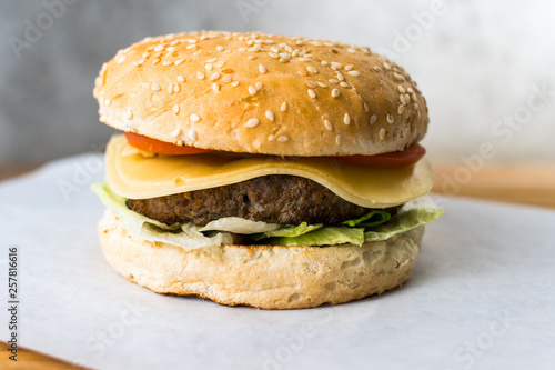 Classic burger on wooden table gray background