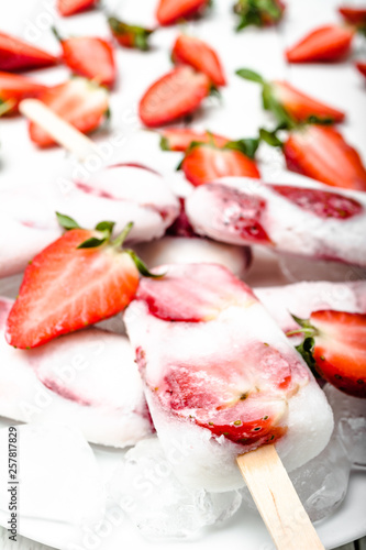 Fresh strawberry popsicles with yogurt and strawberries. Ice cream on sticks.