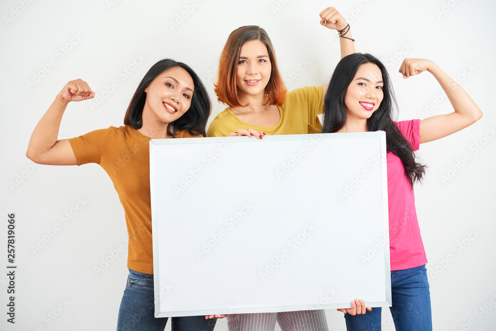 Women showing their girl power - obrazy, fototapety, plakaty 