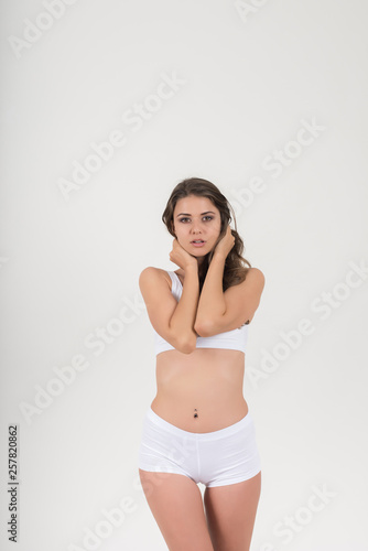 Beautiful woman with healthy body on white background