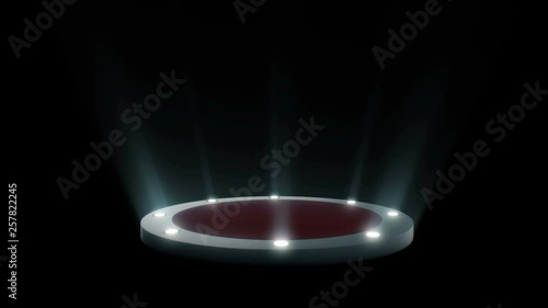 Empty round podium, pedestal or platform with red carpet illuminated by volume spotlights. Set of bright searchlights on black background. Digital 3d animation. photo