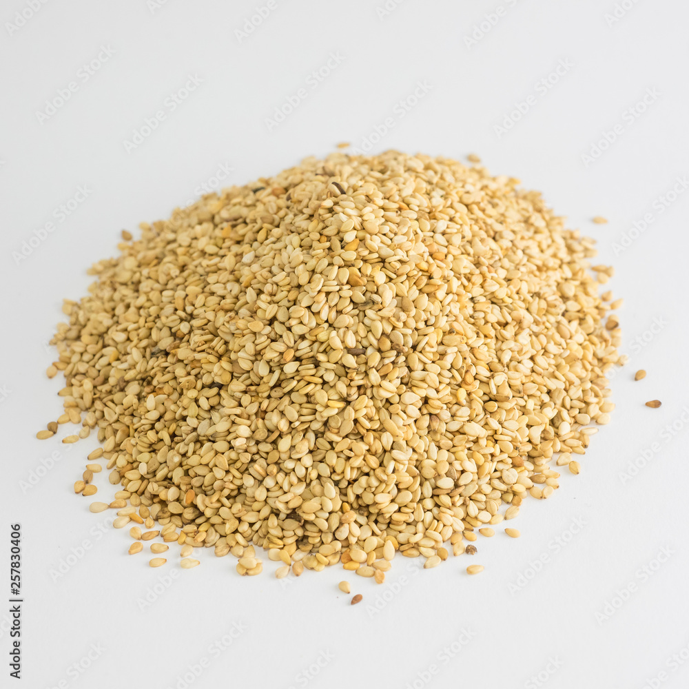 Mountain of sesame seeds on white background Mountain of sesame seeds on white background