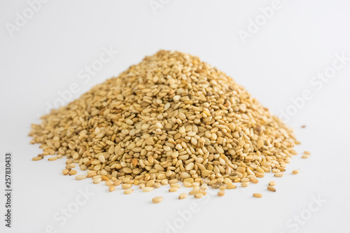 Mountain of sesame seeds on white background