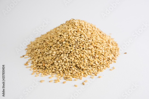 Mountain of sesame seeds on white background