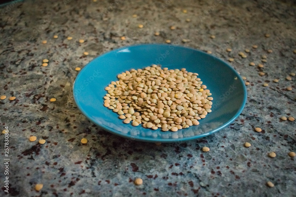 A plate of lentils without cooking A plate of lentils without cooking