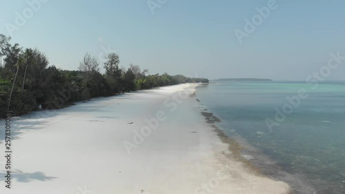 Wallpaper Mural Aerial: flying over desert beach white beach tropical caribbean sea turquoise blue water. Indonesia Kei islands, Moluccas, travel destination diving snorkeling. Native cinelike D-log color profile. Torontodigital.ca