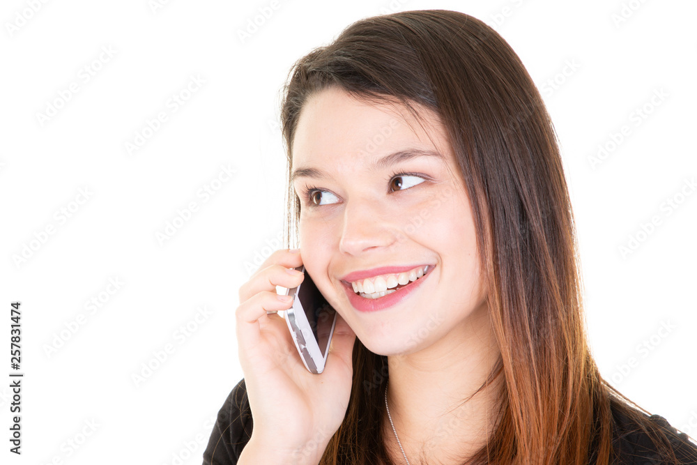 Young smiling woman using a mobile phone under white background Young smiling woman using a mobile phone under white background