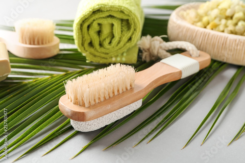 Massage brush on grey background