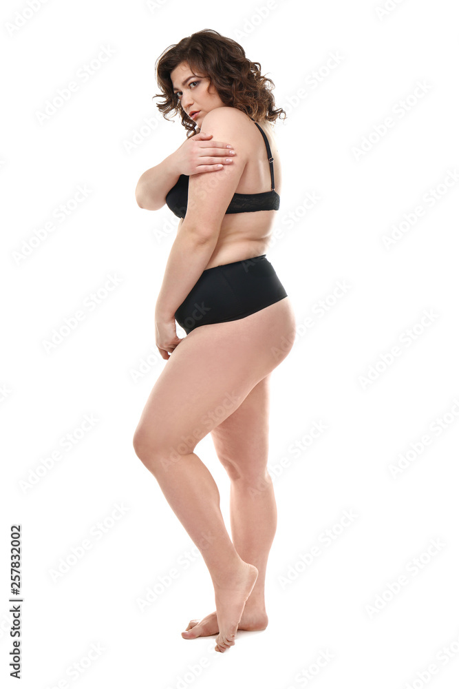 Shy plus size woman on white background. Concept of body positive Shy plus size woman on white background. Concept of body positive