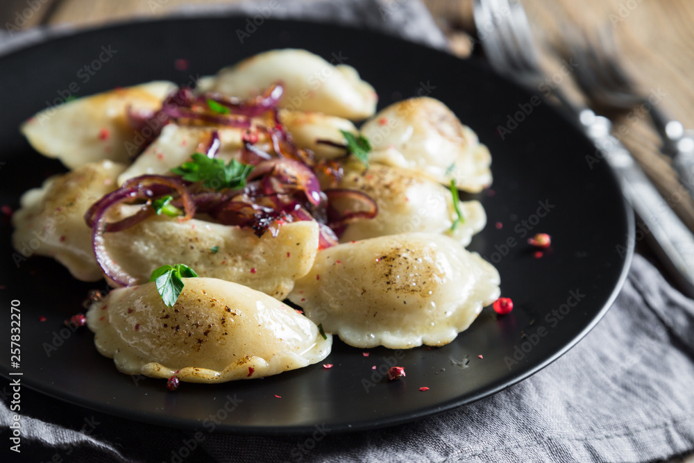 Dumplings, pelmeni, pierogi, with fried onions Dumplings, pelmeni, pierogi, with fried onions