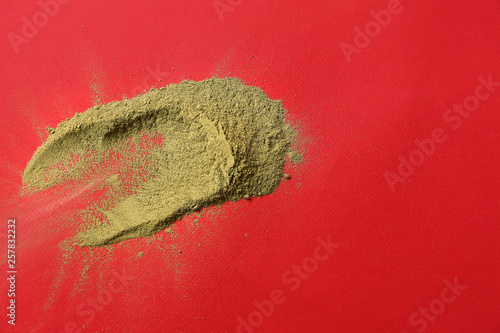 Green powder spill on red b...
