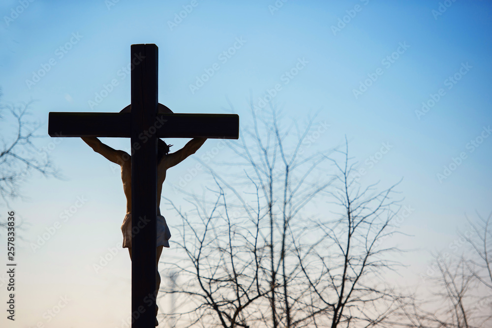 Jesus Christ crucified alone against the sky Jesus Christ crucified alone against the sky