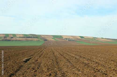 plowed field in spring landscape agriculture photo