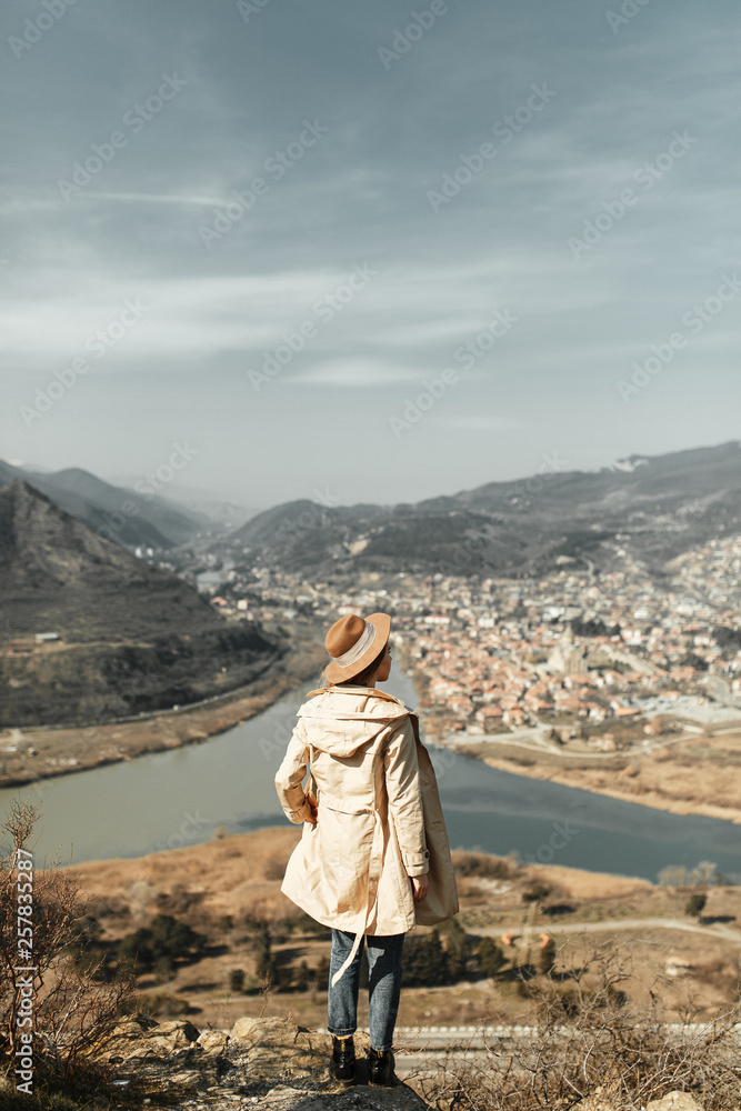 Girl travel blogger outdoors. The ancient capital and the Jvari monastery, Georgia.