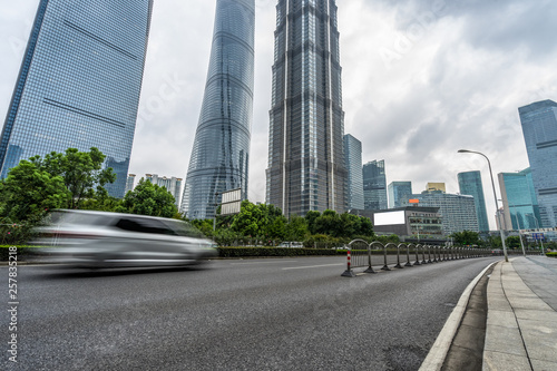 urban city road with motion bus at twilight, china.