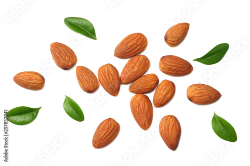 almonds with green leaves isolated on white background. top view.