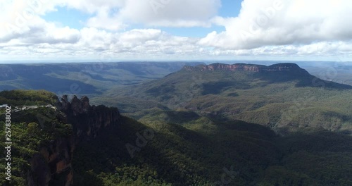 Echo point lookout to rock formation dubbed Three Sisters in Blue Mountains national park of Australia on a sunny summer day. photo