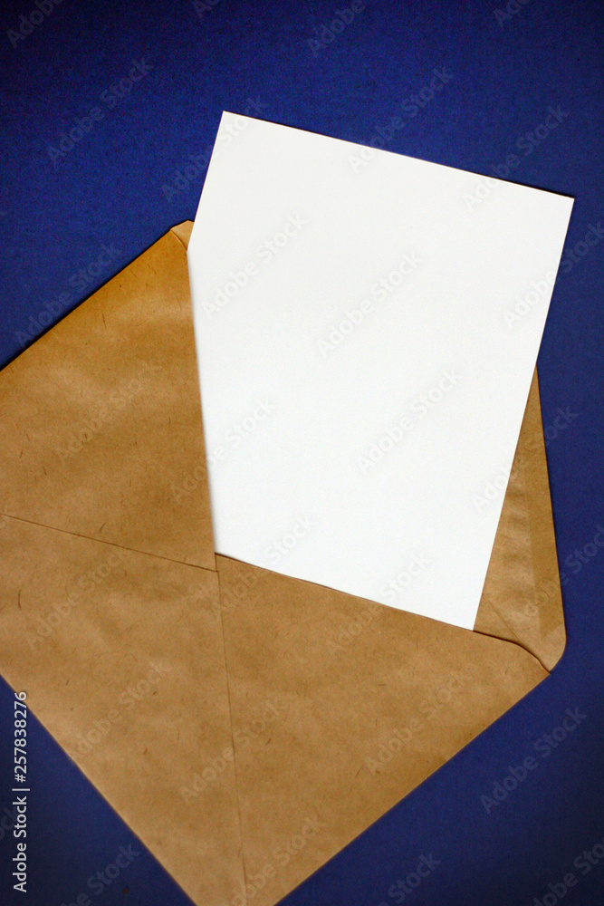 Mockup with envelope, blank card on blue table