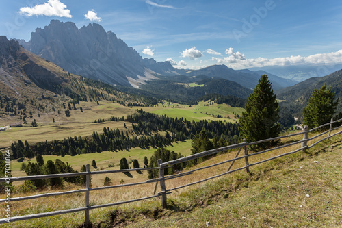 wide autumnal view over a pasture in the val di Funes area Dolomites