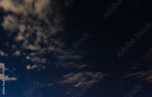 night sky with clouds and stars