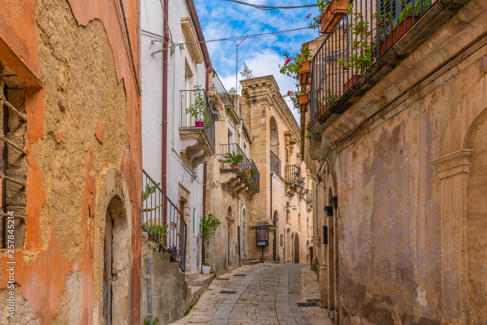 Typical italian street in ancient sicilian town Ragusa in Sicily, Italy 
