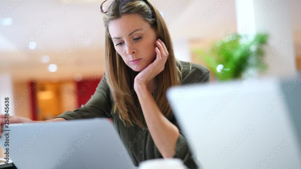 Startup team member working on computer in modern office Startup team member working on computer in modern office