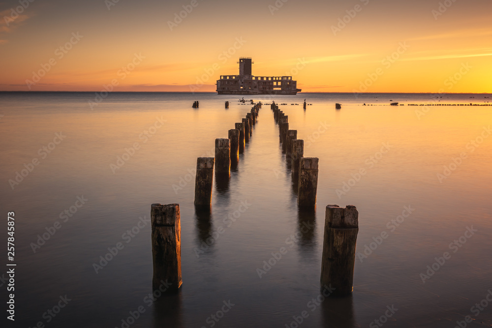 Sunrise over the ruins old military building on Baltic Sea in Babie Doly, Gdynia, Poland