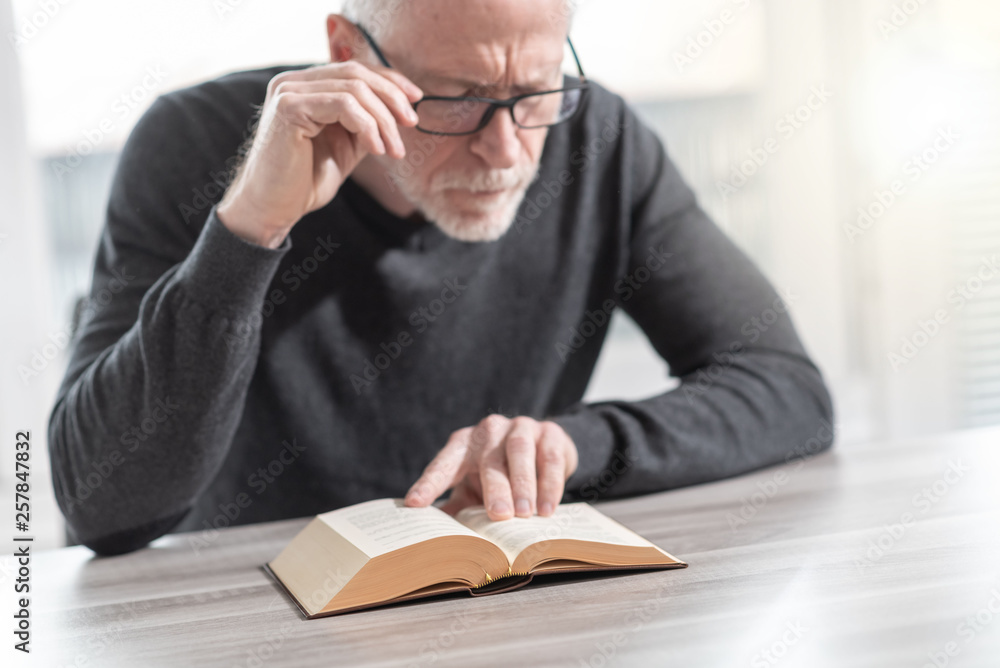 Man reading a book Man reading a book