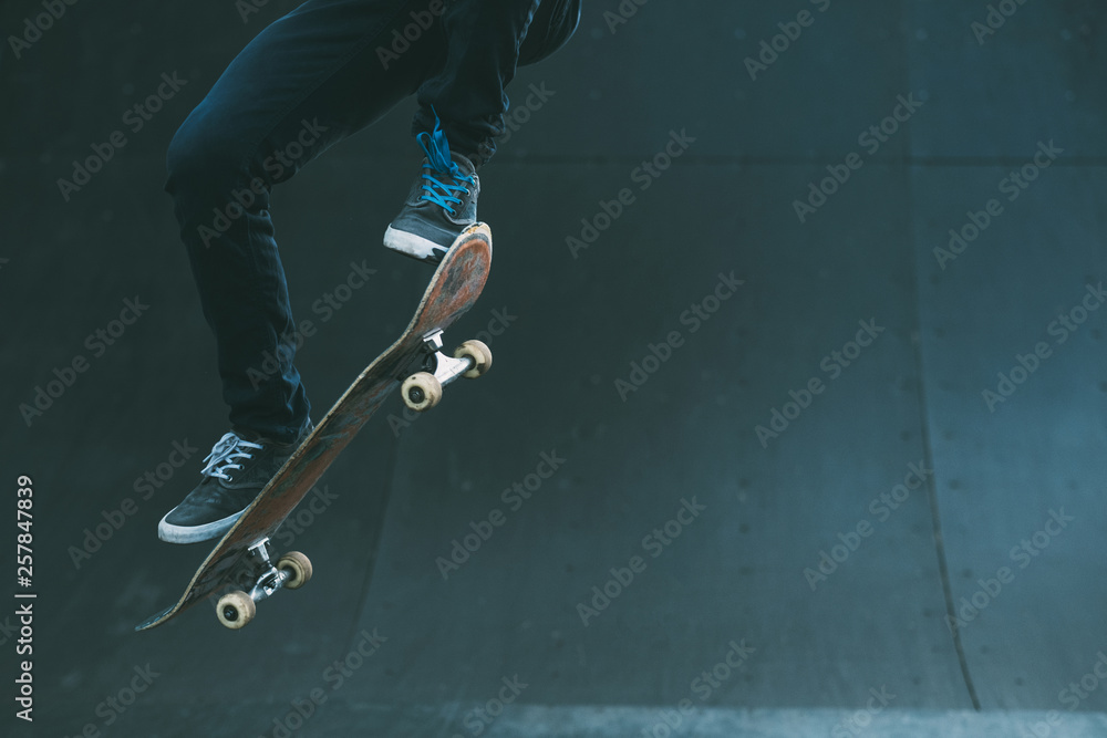Urban skater in action. Ollie trick. Skate park ramp. City area. Man on  skateboard jumping. Copy space for text. Photos | Adobe Stock