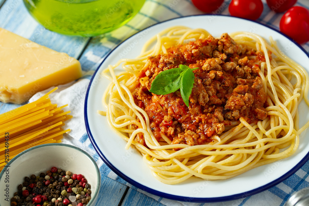 spaghetti bolognese on wooden surface spaghetti bolognese on wooden surface