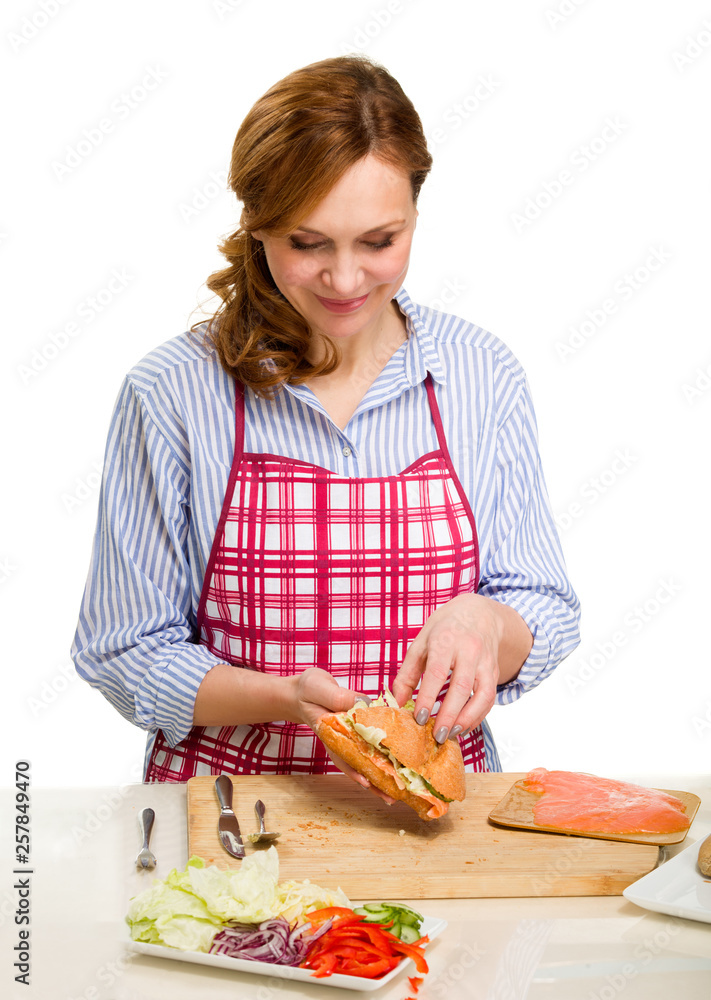 Beautiful Adult Woman Cooking in the kitchen. Beautiful Adult Woman Cooking in the kitchen.