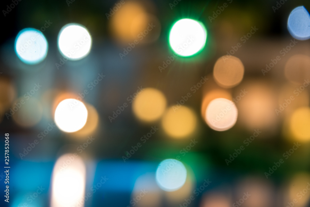 blurred night background, colored lights, water and buildings in defocus blurred night background, colored lights, water and buildings in defocus