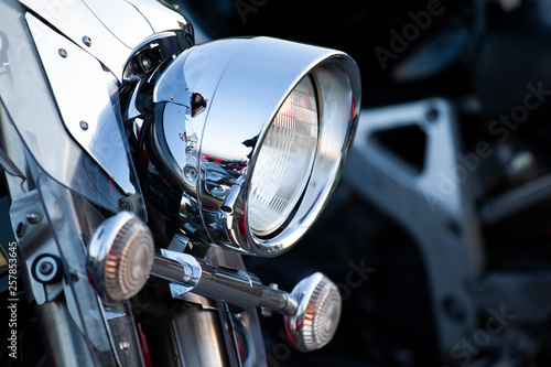 Chromed motorcycle headlights close up