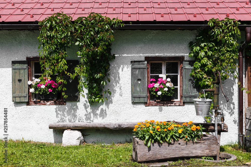 A picturesque house with flowers on the windows in Austria