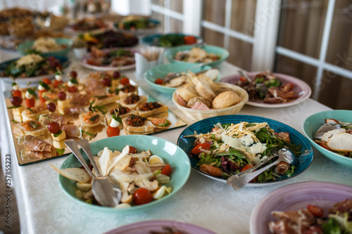 Variety assortment of different luxury food snacks and appetizers, concept of decorated catering banquet set, on a party event celebration