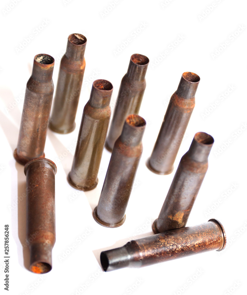 A pile bullet shells on a white background A pile bullet shells on a white background
