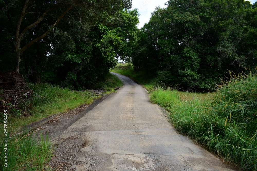 Australian straight weir crossing rural road background Australian straight weir crossing rural road background