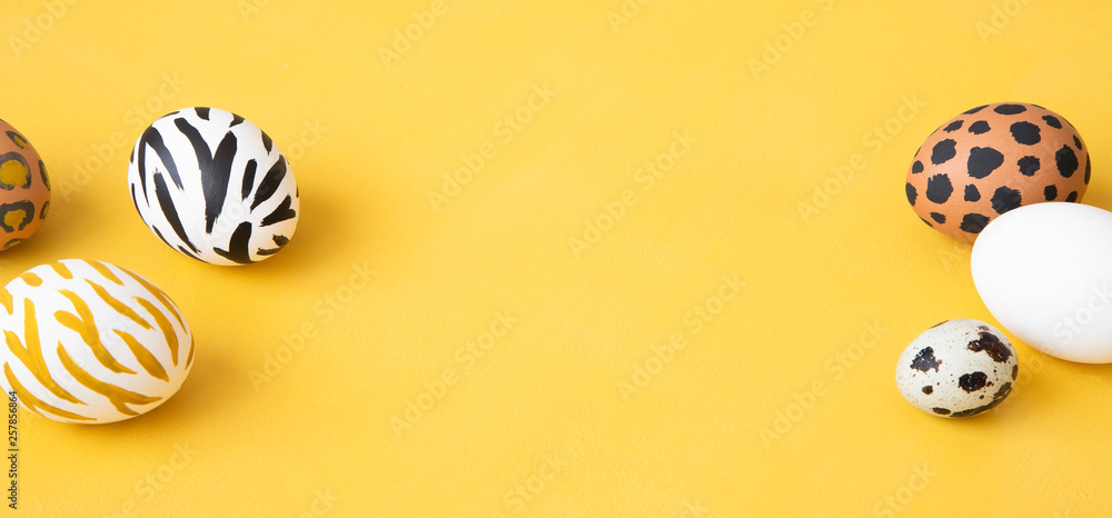 Dyed Easter eggs on yellow background. Creative animal pattern. Dyed Easter eggs on yellow background. Creative animal pattern.
