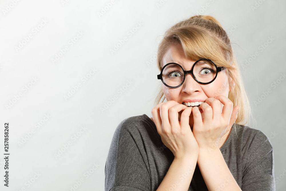 Nervous girl biting nails. Nervous girl biting nails.