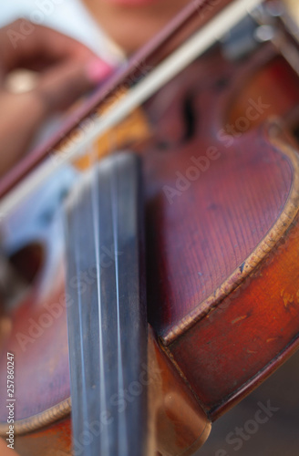 Violin player hands. Violinist playing violin close up .Playing the violin. Musical instrument with performer hands. Selective focus. 
