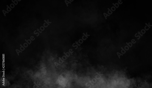 Smoke on the floor . Isolated black background . Misty fog effect texture for text or space