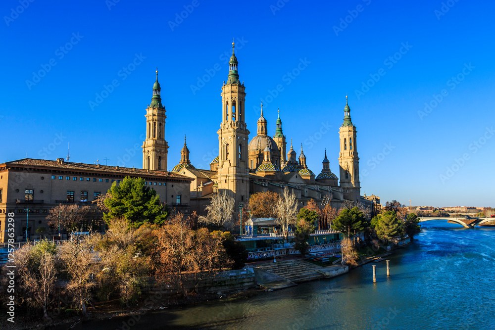 View of Cathedral-Basilica of Our Lady of the Pillar from Puente de Piedra stone bridge in Zaragoza