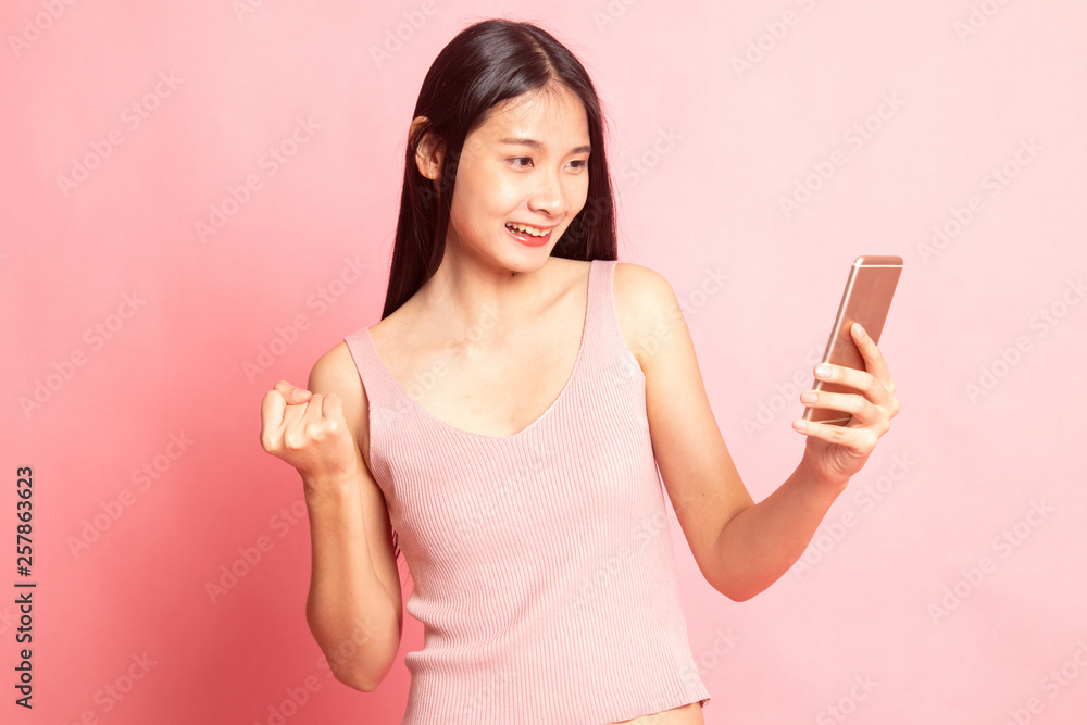 Successful young Asian woman with mobile phone. Successful young Asian woman with mobile phone.