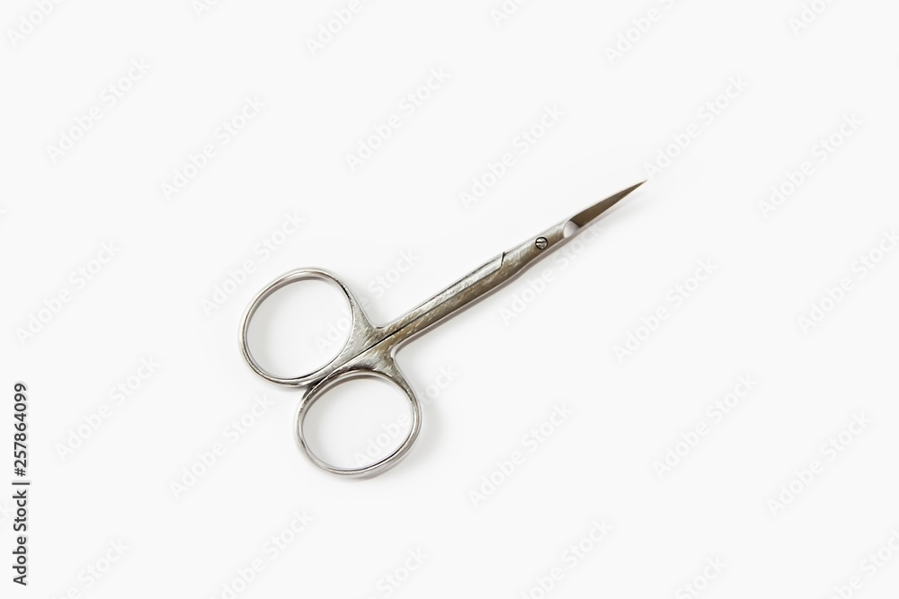 metallic silver manicure sharp scissors on a white background metallic silver manicure sharp scissors on a white background